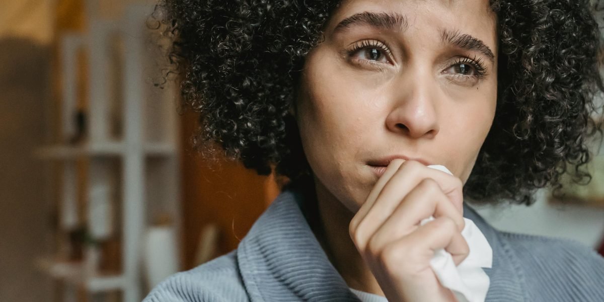 A person appears deep in thought, perhaps feeling overwhelmed by life's challenges, reflecting the initial struggle before seeking therapy.