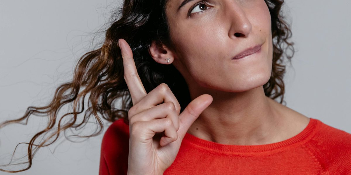 A person sits thoughtfully, considering a significant personal decision.