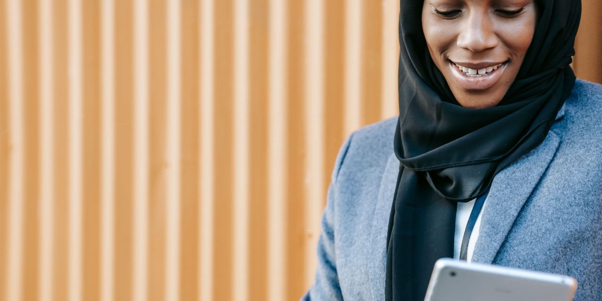A person confidently uses a tablet to research and find information.