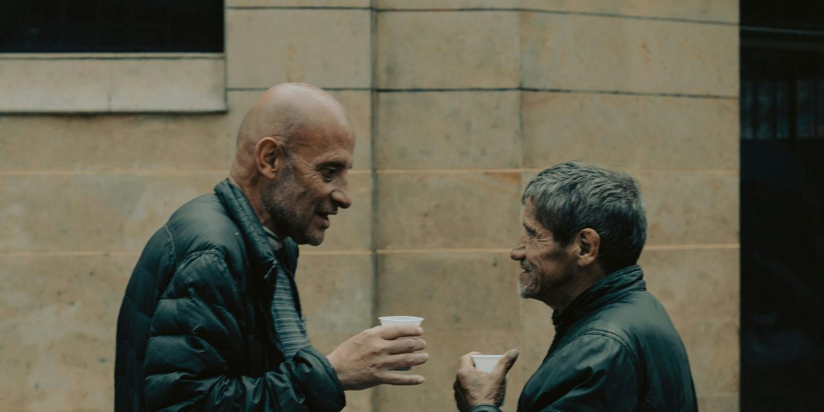 Friends engaged in an honest and supportive conversation, sharing personal experiences.