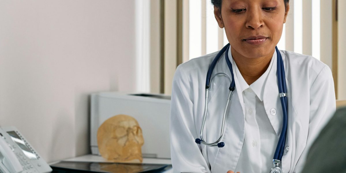 A patient actively engaging with their healthcare provider to clarify details about their care.