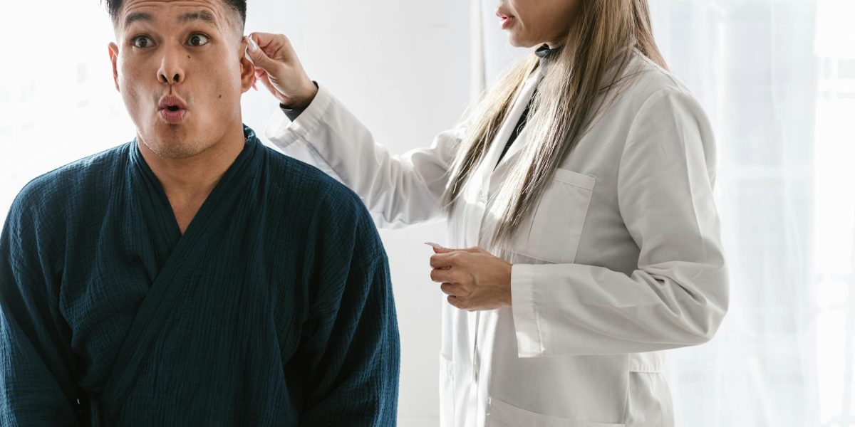 A patient confidently engages in a conversation with their doctor, asking questions.