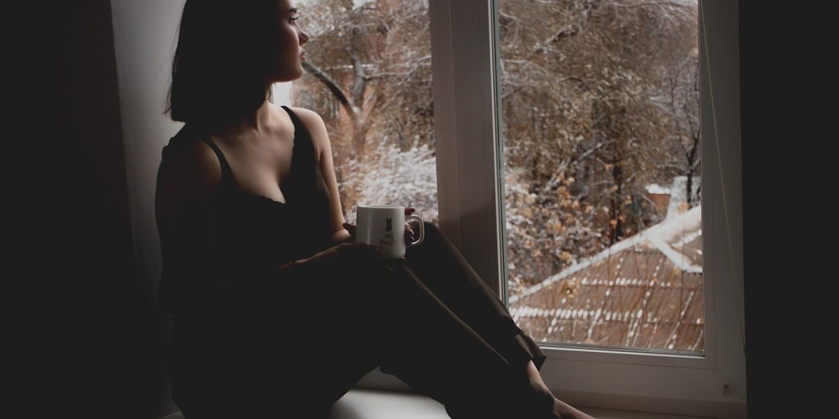 A person experiencing a moment of calm and peace, representing relief and freedom from mental distress.