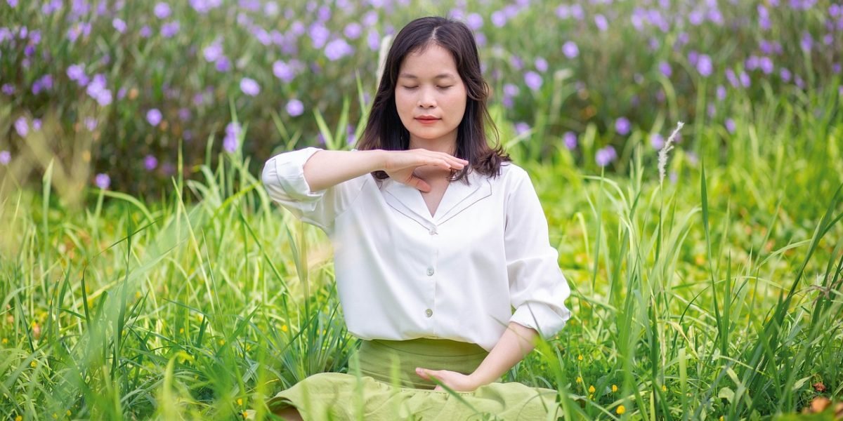 An individual engaging in deep breathing exercises, illustrating a common immediate coping strategy for anxiety.