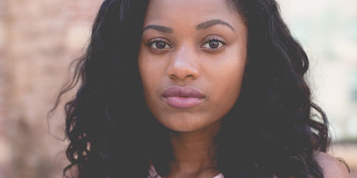 A person feeling confident and empowered after understanding their options for well-being.