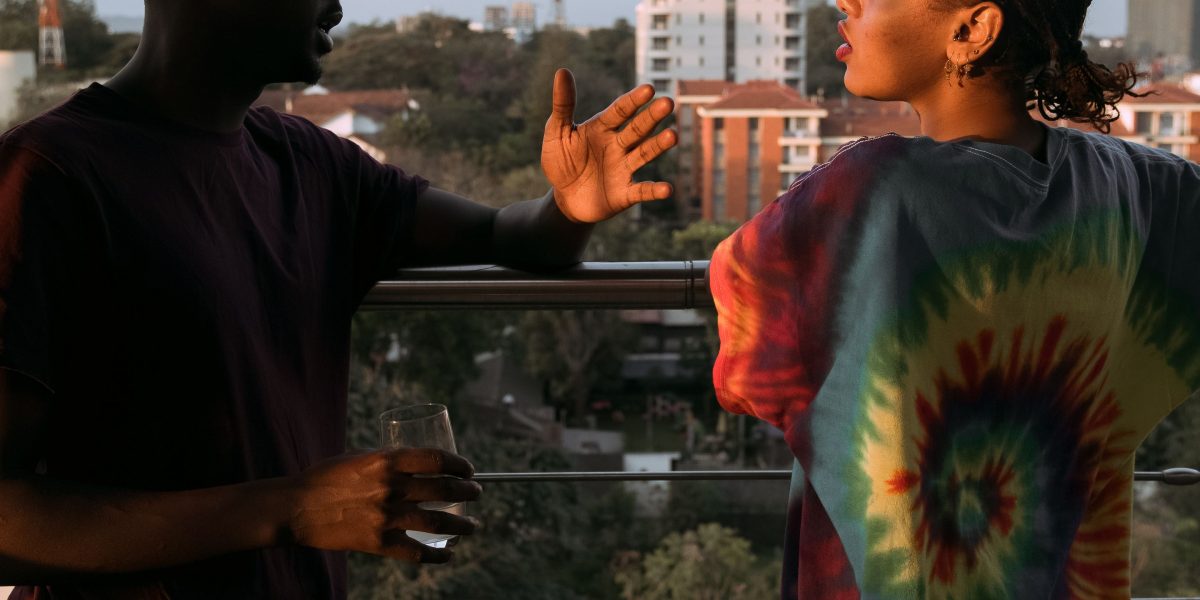 Two friends engage in a supportive conversation, demonstrating empathetic listening.