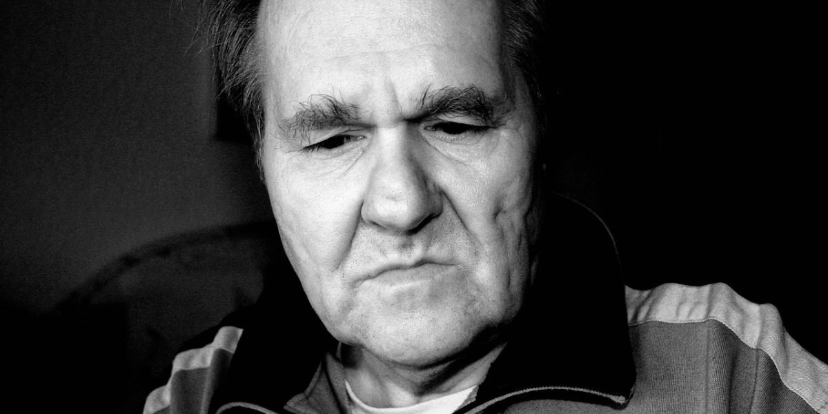 A person looking weary and emotionally drained, reflecting the toll of a difficult relationship.