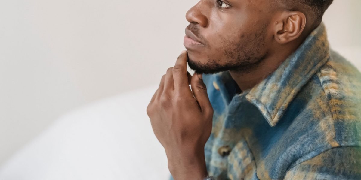 A person thoughtfully considering various therapy options, indicating careful decision-making.