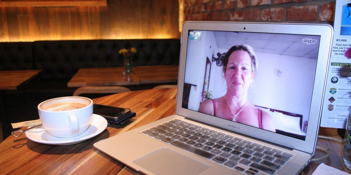 A person comfortably engaging in a virtual counseling session from their home.