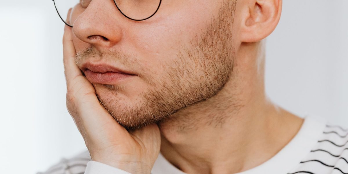 A person in a thoughtful posture, suggesting introspection and reflection on personal worries.
