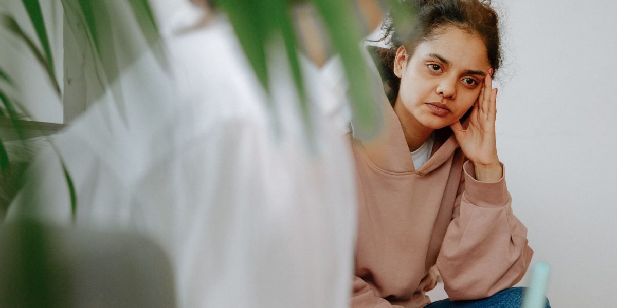 A person engaging in a serious conversation with a professional, highlighting the need for expert help in significant mental health challenges.