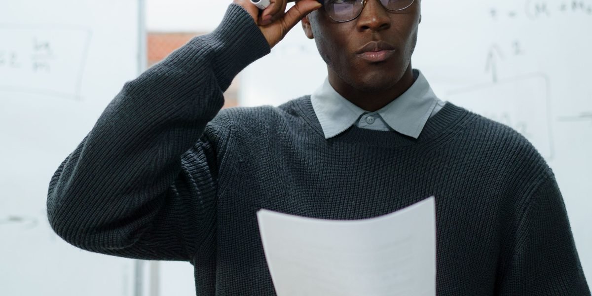 A person looks perplexed while reviewing medical documents, highlighting the challenge of confusing language.