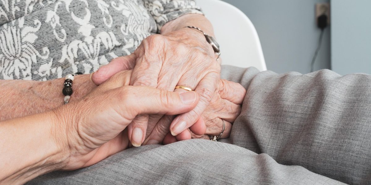 A family offering comforting support to a loved one, symbolizing care and understanding.